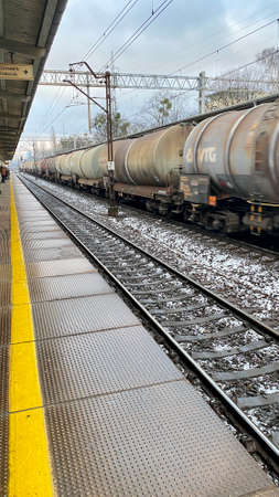 Sopot, Pomorskie Voivodeship, January 8, 2022. Peony railway station, an approaching freight train covered with a roofのeditorial素材