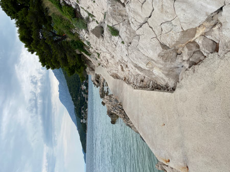 coast maybe adriatic sea beautiful rocky shore in brown colorの写真素材