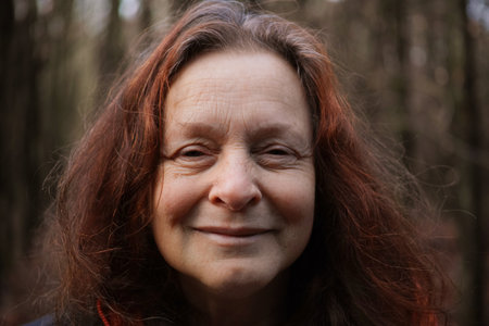 Portrait of a 60 year old smiling woman without make-upの写真素材