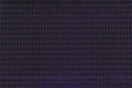 Very old dark colored cover paper with diamonds. Black and purple background