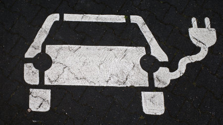 Icon on the asphalt for a parking lot with charging point for electric carsの写真素材