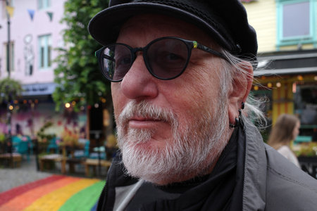 Senior tourist with captains cap in the biggest tourist attraction from Stavanger, Norway:...