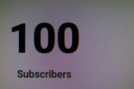 100 subscribers shown on a lcd monitorの写真素材