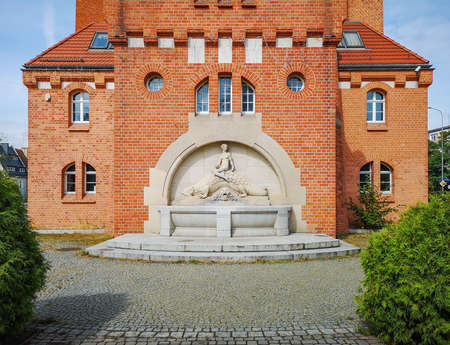 Wroclaw August 14 2018 Symmetrical view to fountain with relief on side of Water Towerのeditorial素材