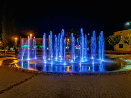 Zawiercie August 28 2018 Spiral splashing fountain at city center in cloudy day at nightのeditorial素材