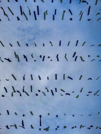Material stripes hanged on lines over market square in Poznanの写真素材