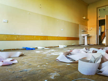 Old blinds lay on dirty floor in old abandoned hospitalの写真素材