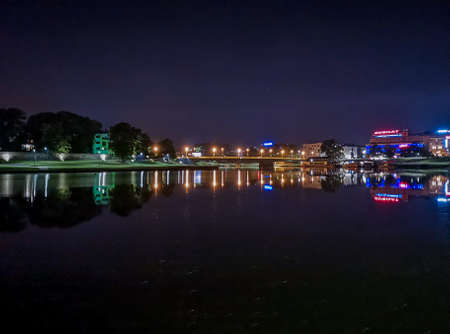 Cracow July 25 2019 Night cityscape lights reflected in waterのeditorial素材