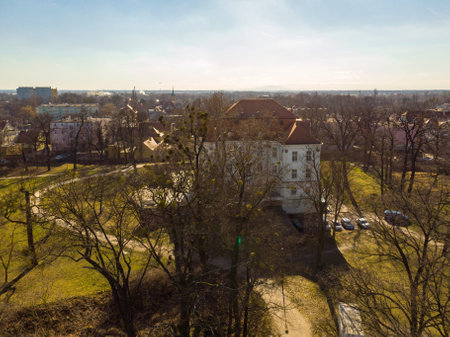 Wroclaw, Poland - February 20 2020 White Cultural Center "Zamek" ("Castle") with orange roof with trees in front ofのeditorial素材