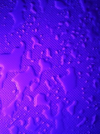 Splashes of water on shower tray highlighted in color
