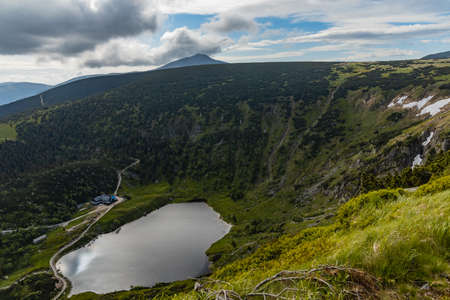 Small pond down to mountain trail in Giant Mountains next to Samotnia mountain shelterの写真素材