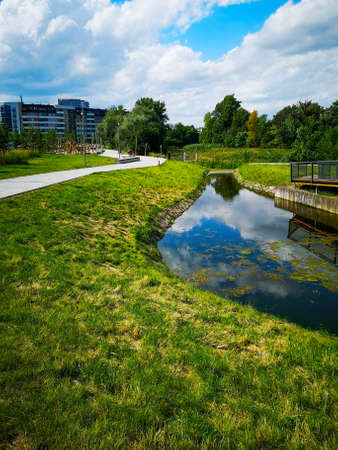 Wroclaw, Poland - July 1 2020: Path next to river with park around next to estateのeditorial素材
