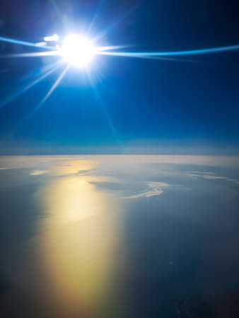 Aerial view from plane to morning sunrise over the oceanの写真素材