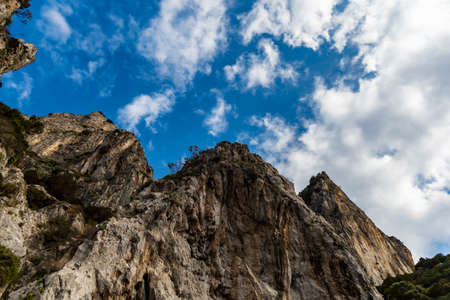 Edge of high cliff next to the sea at sunny day on Capri islandの写真素材
