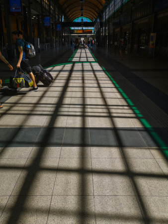 Wroclaw, Poland - August 12 2020: Play of lights with Green sun light on floor of main railway...