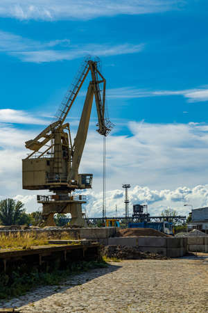 Wroclaw, Poland - September 2 2020: High machines at city port in front of factory square