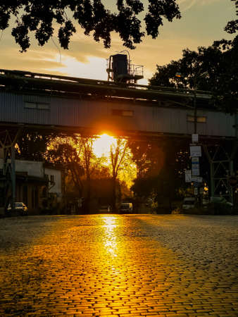 Wroclaw, Poland - September 2 2020: Beautiful sunset over long brick road at old factory squareのeditorial素材