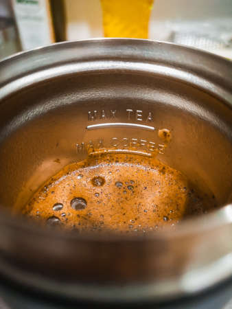 Thermal mug with coffee and mark with max coffee and max teaの写真素材