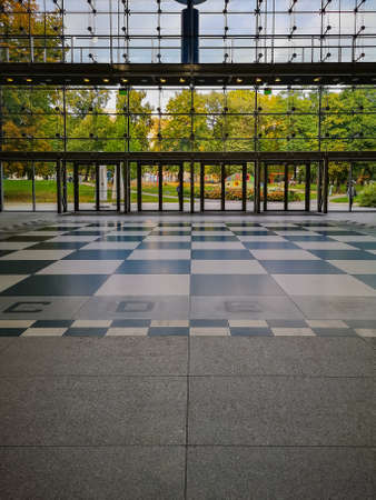 Poznan, Poland - October 2 2020: Big chessboard on the floor of Old Brewery shopping mall in front of big glassy entranceのeditorial素材