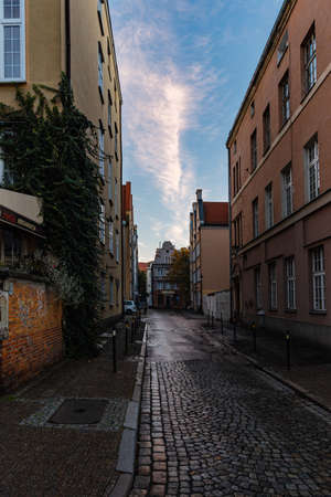 Gdansk, Poland - October 24 2020: Short narrow street next to long market square buildings