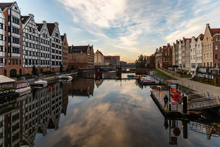 Gdansk, Poland - October 24 2020: Buildings of old city over Motlawa river at morning seen from green bridgeのeditorial素材