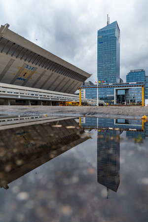 Gdansk, Poland - October 24 2020: Facade of hall Olivia building in front of Olivia Star corporate building reflected in puddleのeditorial素材