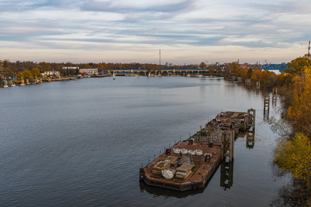 Wroclaw, Poland - November 15 2020: Small construction on the river next to harbor under the Milenijny bridgeのeditorial素材