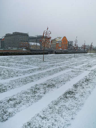 Wroclaw, Poland - December 3 2020: Small square with Labyrinth in the grass full of snow at winterのeditorial素材