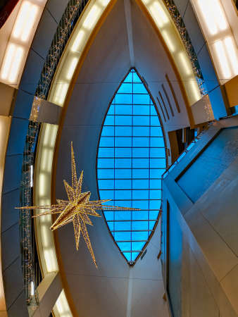 Wroclaw, Poland - December 11 2020: Looking up to skylight window in the roof of shopping mall with christmas decorationsのeditorial素材