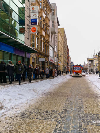 Wroclaw, Poland - February 2021: Swidnicka street with fire brigade car and long queue to donut shop at fat Thursdayのeditorial素材