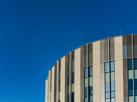 Wroclaw, Poland - February 2021: Top of round Sagittarius building at sunny day