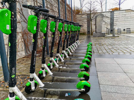 Wroclaw, Poland - March 2021: Long row of scooters next to main railway station at rainy dayのeditorial素材