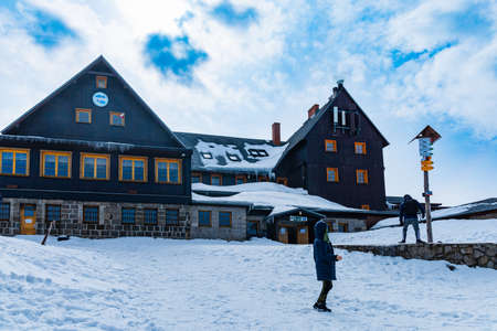 Giant Mountains, Poland - March 2021: Hala Szrenicka shelter building at cloudy winter day