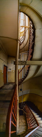 Wroclaw, Poland - March 2021: Vertical panorama of spiral staircase in old tenement houseのeditorial素材