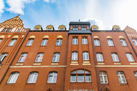 Legnica, Poland - April 2021: Facade of old modern renovated tenement building