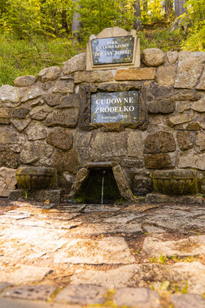 Jelenia Gora, Poland - June 2021: Wonderful water spring landmark next to mountain trailのeditorial素材
