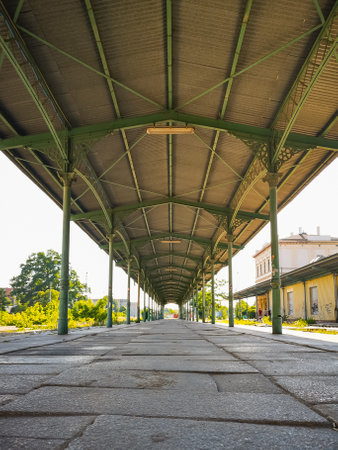 Wroclaw, Poland - June 2021: Long green roof of old platform at old Wroclaw Swiebodzki railway stationのeditorial素材