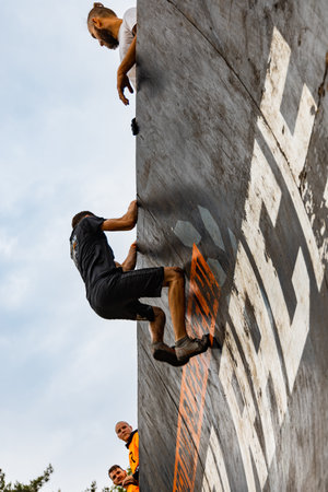 Poznan, Poland - June 2021: An hard extreme obstacle course Survival Race at rainy dayのeditorial素材