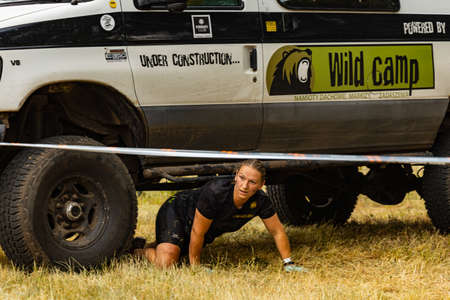 Poznan, Poland - June 2021: An hard extreme obstacle course Survival Race at rainy day
