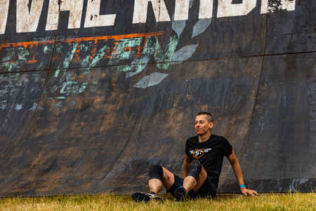 Poznan, Poland - June 2021: An hard extreme obstacle course Survival Race at rainy day