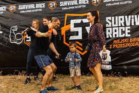 Poznan, Poland - June 2021: An hard extreme obstacle course Survival Race at rainy dayのeditorial素材