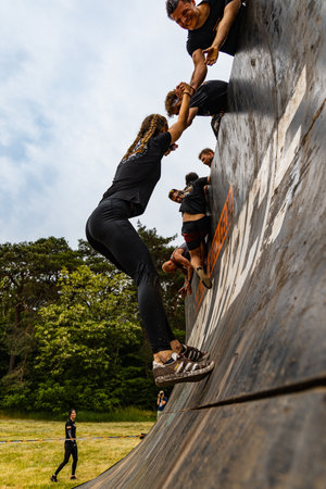 Poznan, Poland - June 2021: An hard extreme obstacle course Survival Race at rainy dayのeditorial素材