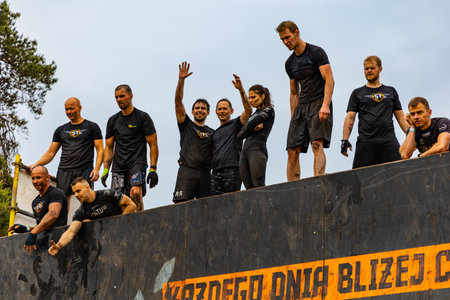 Poznan, Poland - June 2021: An hard extreme obstacle course Survival Race at rainy day