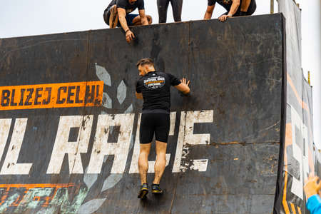 Poznan, Poland - June 2021: An hard extreme obstacle course Survival Race at rainy dayのeditorial素材