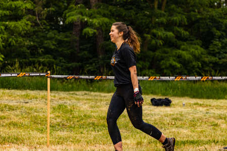 Poznan, Poland - June 2021: An hard extreme obstacle course Survival Race at rainy day