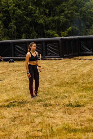 Poznan, Poland - June 2021: An hard extreme obstacle course Survival Race at rainy dayのeditorial素材
