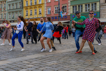 Wroclaw, Poland - April 2022: A lot of people dancing Rueda de Casino open event at market squareのeditorial素材