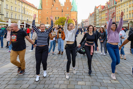Wroclaw, Poland - April 2022: A lot of people dancing Rueda de Casino open event at market squareのeditorial素材