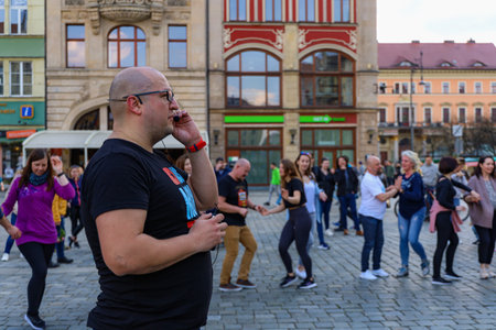 Wroclaw, Poland - April 2022: A lot of people dancing Rueda de Casino open event at market square
