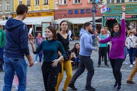 Wroclaw, Poland - April 2022: A lot of people dancing Rueda de Casino open event at market square